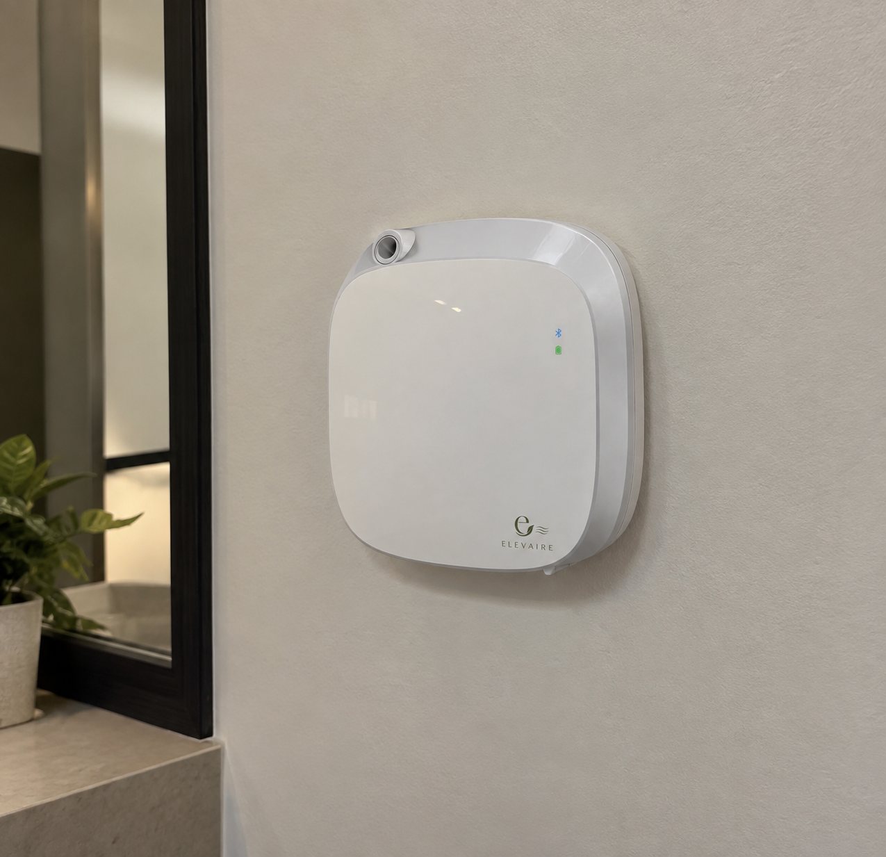 Elevaire cold mist diffuser mounted on a restroom wall